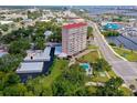 An aerial view showcasing the condo, pool, and parking at 404 S Beach St # 240 701, Daytona Beach, FL 32114