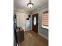 Bright entryway with tile floors and a wooden door at 444 S Deerwood Ave, Orlando, FL 32825