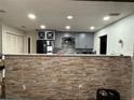 Kitchen with a stone wall breakfast bar and modern cabinets at 444 S Deerwood Ave, Orlando, FL 32825
