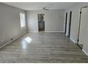 Spacious living room with gray walls and wood-look flooring at 610 Division St, Daytona Beach, FL 32114