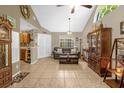 Spacious living room with vaulted ceiling and tile flooring at 963 Helmsley Ct # 207, Lake Mary, FL 32746