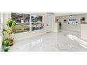 Bright living room with marble floors and a view of the front yard at 118 N Sunland Dr, Sanford, FL 32773