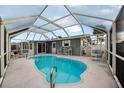 Refreshing pool area with screened enclosure at 15 Longfellow Cir, Ormond Beach, FL 32176