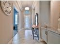 Bright entryway with tile floors and a decorative console table at 2423 Wild Turkey Creek Ln, Port Orange, FL 32128
