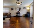 Bright living room with hardwood floors and a cozy sitting area at 2911 Wild Pepper Ave, Deltona, FL 32725
