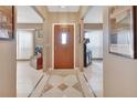 Bright entryway with tile floor and wood door at 2994 Annez Way, Debary, FL 32713
