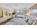 Second bedroom with two double beds and a coastal theme at 3509 S Atlantic Ave # 301, New Smyrna Beach, FL 32169