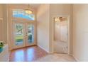 Bright foyer features tile flooring, decorative window, and a double-door entryway, creating an inviting ambiance at 419 Still Forest Ter, Sanford, FL 32771