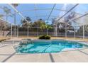 Inviting screened-in pool and spa provides a private outdoor oasis, great for entertaining and relaxation at 419 Still Forest Ter, Sanford, FL 32771