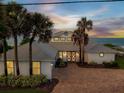 Two-story beachfront home with a paver driveway and ocean views at 4707 S Atlantic Ave, Ponce Inlet, FL 32127