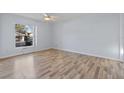 Spacious bedroom featuring laminate floors and ceiling fan at 689 Wellington Station Blvd # 41, Ormond Beach, FL 32174