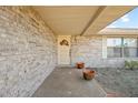 Front entry with brick walkway and potted plants at 783 S Atmore Cir, Deltona, FL 32725