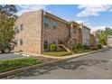 Brick building exterior with landscaping and parking at 117 N Garfield Ave # 1, Deland, FL 32724