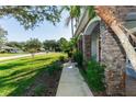 Landscaped walkway leading to the home's entrance at 12 Peruvian Ln, Ormond Beach, FL 32174