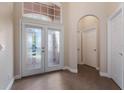 Bright and airy foyer with double doors and tile flooring at 1278 Chessington Cir, Lake Mary, FL 32746