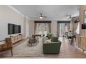 Bright, open living room featuring hardwood floors, neutral colors, and stylish modern furniture at 1278 Chessington Cir, Lake Mary, FL 32746