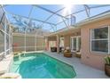 Inviting screened-in pool with covered patio area and outdoor seating, perfect for relaxation at 1278 Chessington Cir, Lake Mary, FL 32746