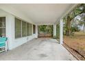 Covered concrete patio with access to backyard at 1579 Dunlap Dr, Deltona, FL 32725