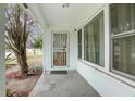 Front porch with security door and large windows at 1579 Dunlap Dr, Deltona, FL 32725