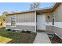 Front door entrance with walkway and landscaping at 1768 Santee Ave, Deltona, FL 32738