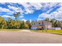 Two-story house on a corner lot with a view of the street at 210 Jacobs Landing Ct, Deland, FL 32724