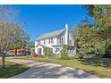 Two-story home with a long driveway and mature trees at 2133 Eau Claire Ave, Deland, FL 32724