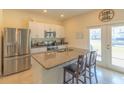 Modern kitchen with stainless steel appliances and granite countertops at 3033 Meleto Blvd, New Smyrna Beach, FL 32168