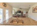 Kitchen island with double sink overlooks living room at 3033 Meleto Blvd, New Smyrna Beach, FL 32168