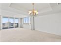 Bright living room featuring large windows with water views at 3047 S Atlantic Ave # 1906, Daytona Beach, FL 32118