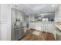 Modern kitchen featuring stainless steel refrigerator and granite countertops at 325 N Causeway # C301, New Smyrna Beach, FL 32169