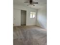 Spacious bedroom with ample closet space and neutral carpeting at 334 Scottsdale Sq # 334, Winter Park, FL 32792