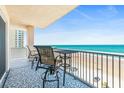 Relax on this oceanfront balcony with chairs and a table to enjoy the amazing beach views at 3737 S Atlantic Ave # 502, Daytona Beach, FL 32118