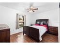 Spacious bedroom with a queen bed and ceiling fan at 501 W Lisbon Pkwy, Deland, FL 32720