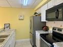 Efficient kitchen with stainless steel appliances at 701 Perkins St # 100, Leesburg, FL 34748
