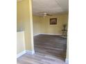 Spacious living room features updated flooring and neutral paint, perfect for relaxing or entertaining at 701 Perkins St # 100, Leesburg, FL 34748
