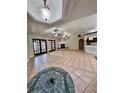 Large living room with tile floors and a fireplace at 8101 Via Bonita St, Sanford, FL 32771