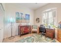 Bright home office features a desk, dresser, and coastal-themed decor at 123 Ponce Terrace Cir, Ponce Inlet, FL 32127
