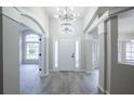 Bright and airy entryway with high ceilings and wood-look tile at 130 Old Sunbeam Dr, South Daytona, FL 32119