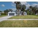 Single-story house with a gray roof and white exterior at 130 Old Sunbeam Dr, South Daytona, FL 32119