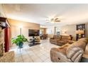 Spacious living room with tiled floor, ceiling fan, and comfortable seating at 1413 La Paloma Cir, Winter Springs, FL 32708