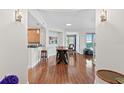 Open concept dining area with hardwood floors and modern table at 1925 S Atlantic Ave # 703, Daytona Beach, FL 32118