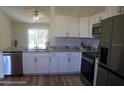 Modern kitchen with stainless steel appliances and granite countertops at 222 Oak Branch Dr, Edgewater, FL 32141