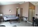 Living room features a gray couch and tile floors at 3019 N Covington Dr, Deltona, FL 32738
