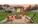 Cozy backyard with fire pit and seating area, perfect for entertaining at 304 Gardenia Ave, Debary, FL 32713