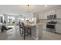 Modern kitchen featuring granite countertops and stainless steel appliances at 37 Bella Lago Cir, Port Orange, FL 32129