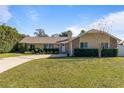 Single-story home with landscaped yard and driveway at 373 Blythville Ave, Deltona, FL 32725