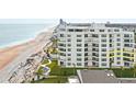 Oceanfront property, showing building and beach at 395 S Atlantic Ave # 301, Ormond Beach, FL 32176