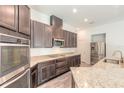 Modern kitchen with stainless steel appliances and granite countertops at 462 Tuscany Chase Dr, Daytona Beach, FL 32117