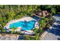 Community pool with a covered patio and plenty of lounge chairs at 462 Tuscany Chase Dr, Daytona Beach, FL 32117