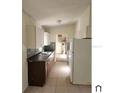 Simple kitchen with light cabinets and tile floor at 5108 Cassatt Ave, Orlando, FL 32808